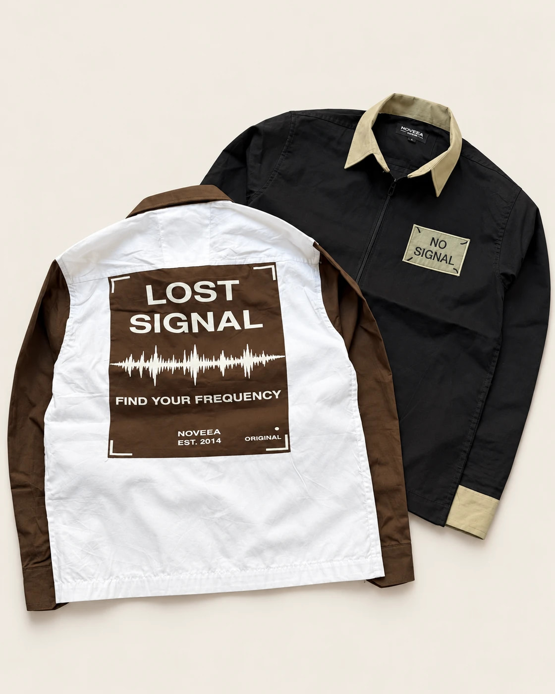 Two samples: a black and khaki zip shirt with a No Signal patch and an ivory and brown shirt showing a Lost Signal back print