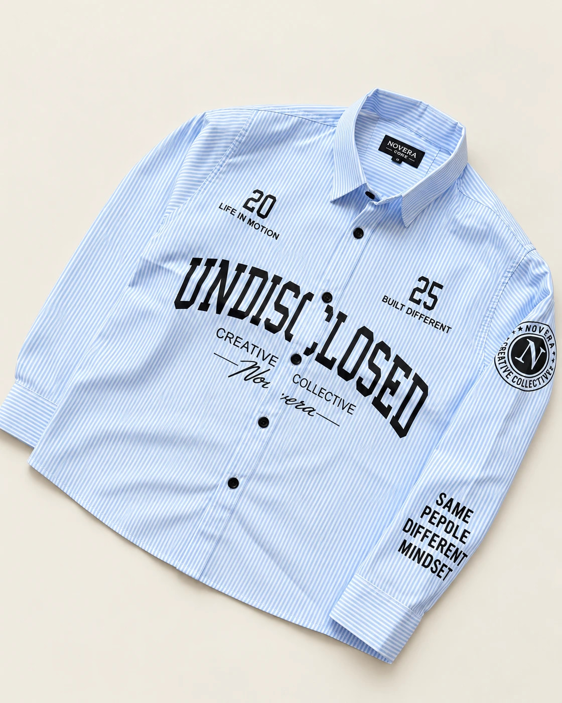 Blue-and-white striped shirt with black front lettering, numbers and sleeve artwork